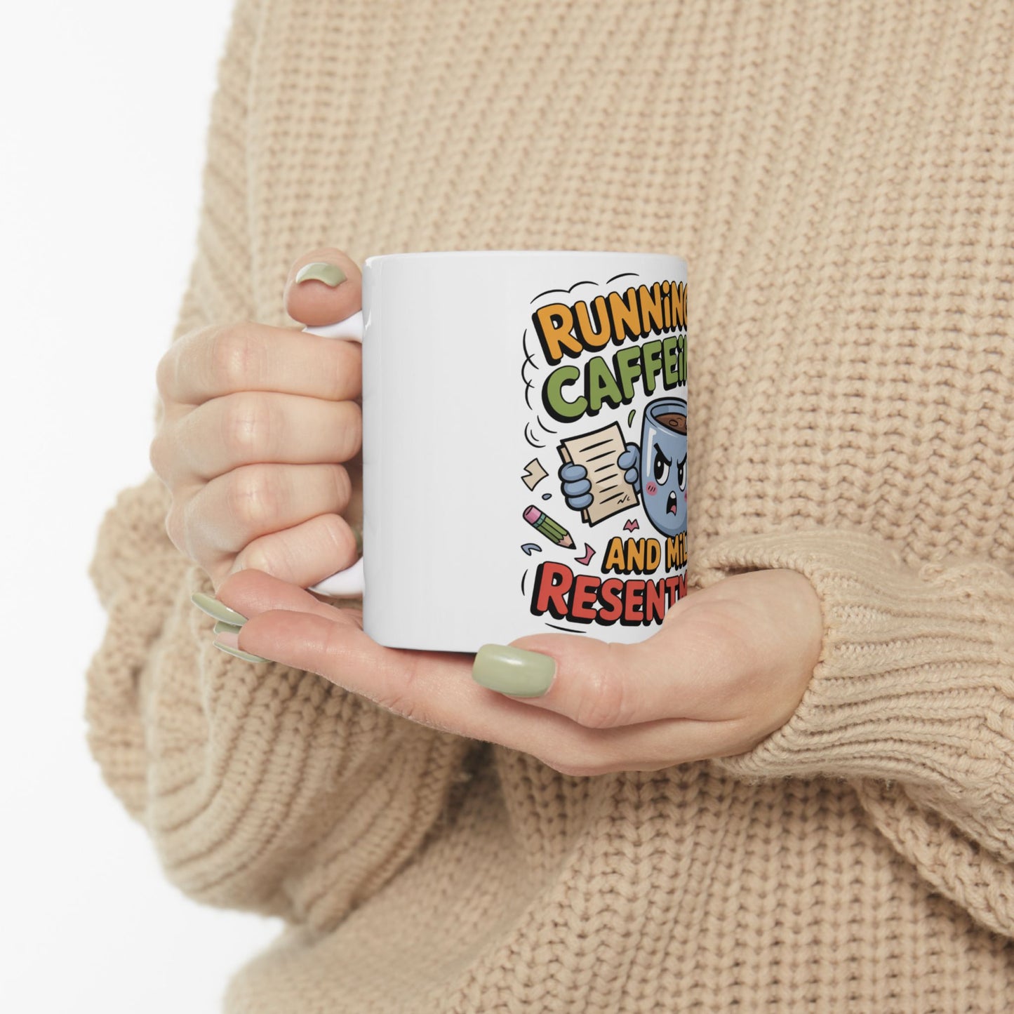White mug with cartoon text "RUNNING ON CAFFEINE AND RESENTMENT".