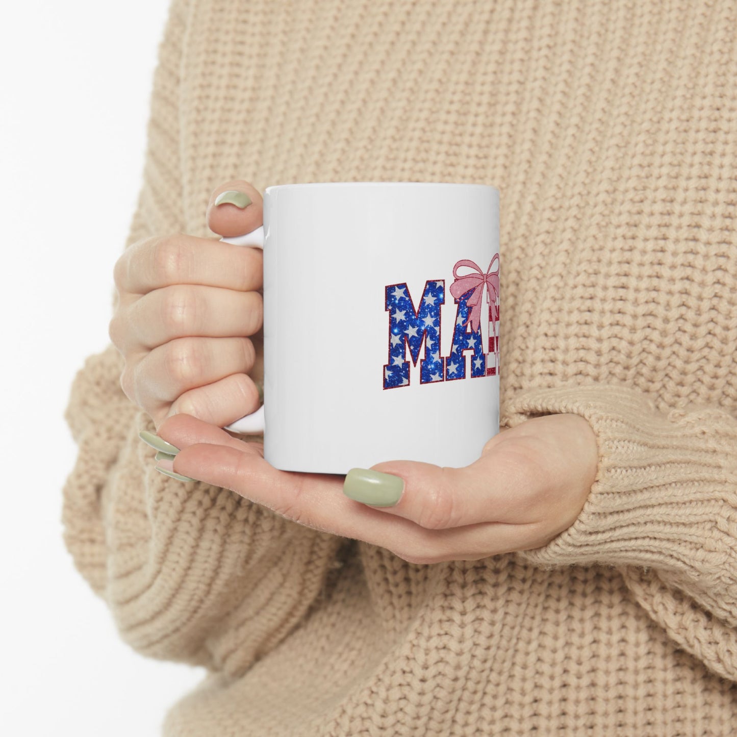 White mug with "MAY" in patriotic lettering and a pink bow.