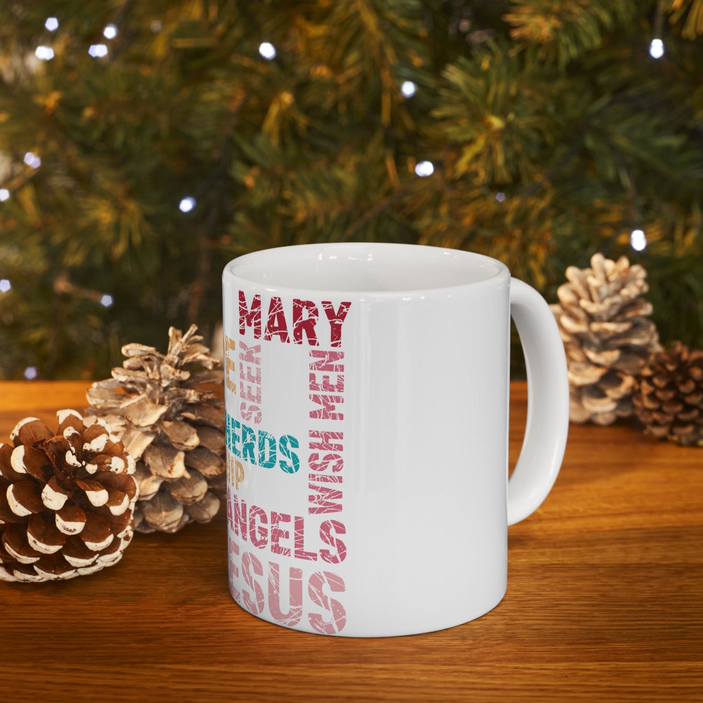 White mug with "MARY" and "ANGELS" in vertical text, on a wooden surface.