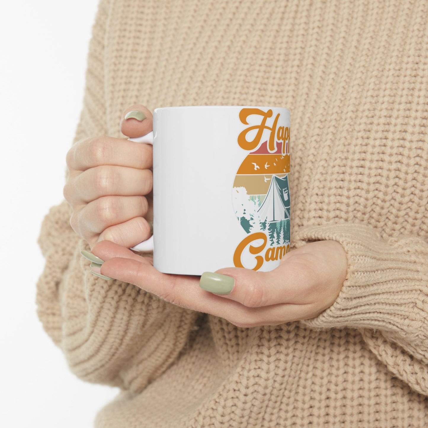 White mug with "Happy Camper" text and a camping scene graphic.