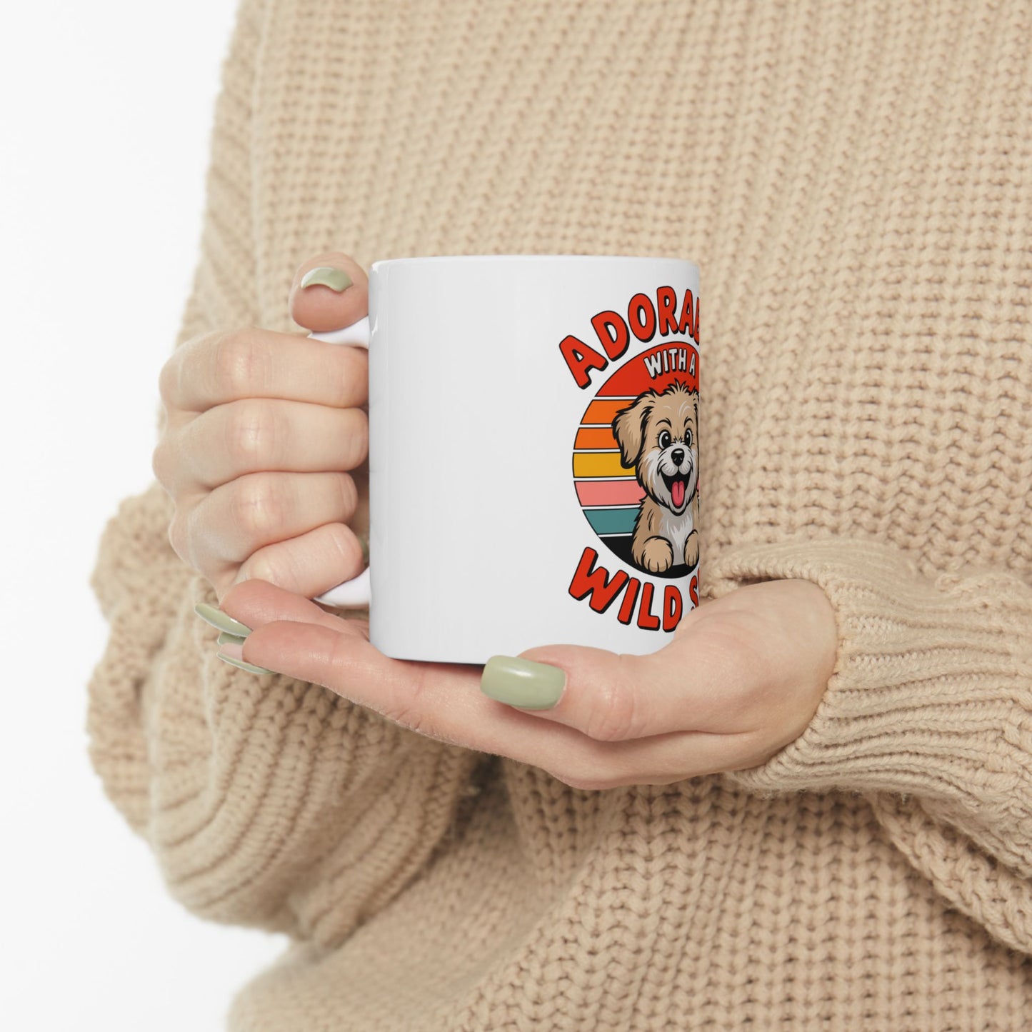 White mug with "Adorably Wild" text and cartoon dog illustration.