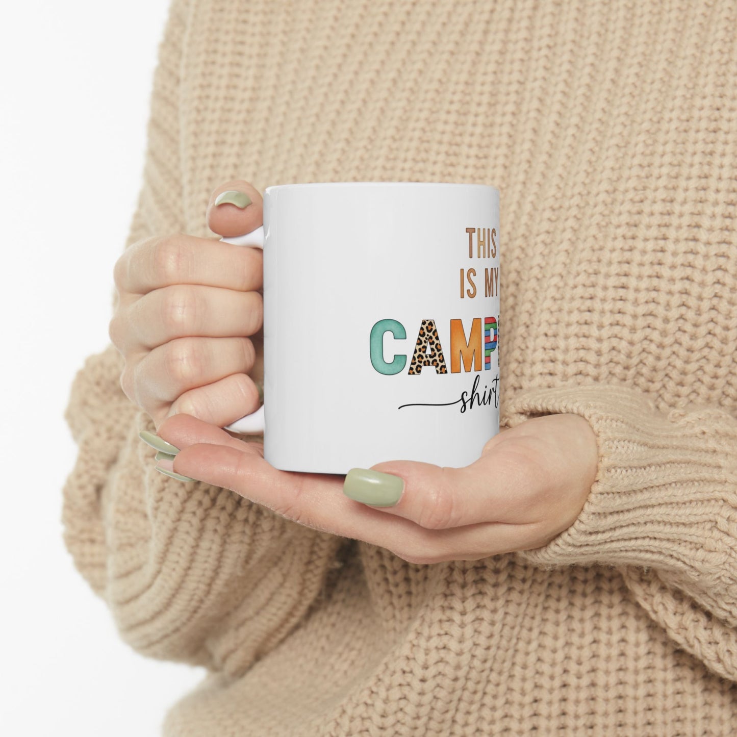 White mug with "This is my camp shirt" text and colorful leopard print letters.