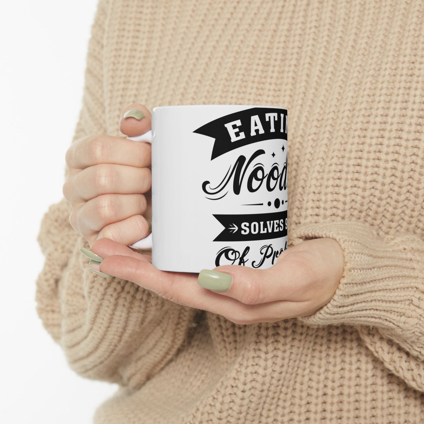 White mug with "Eating Noodles Solves Problems" text in black lettering.