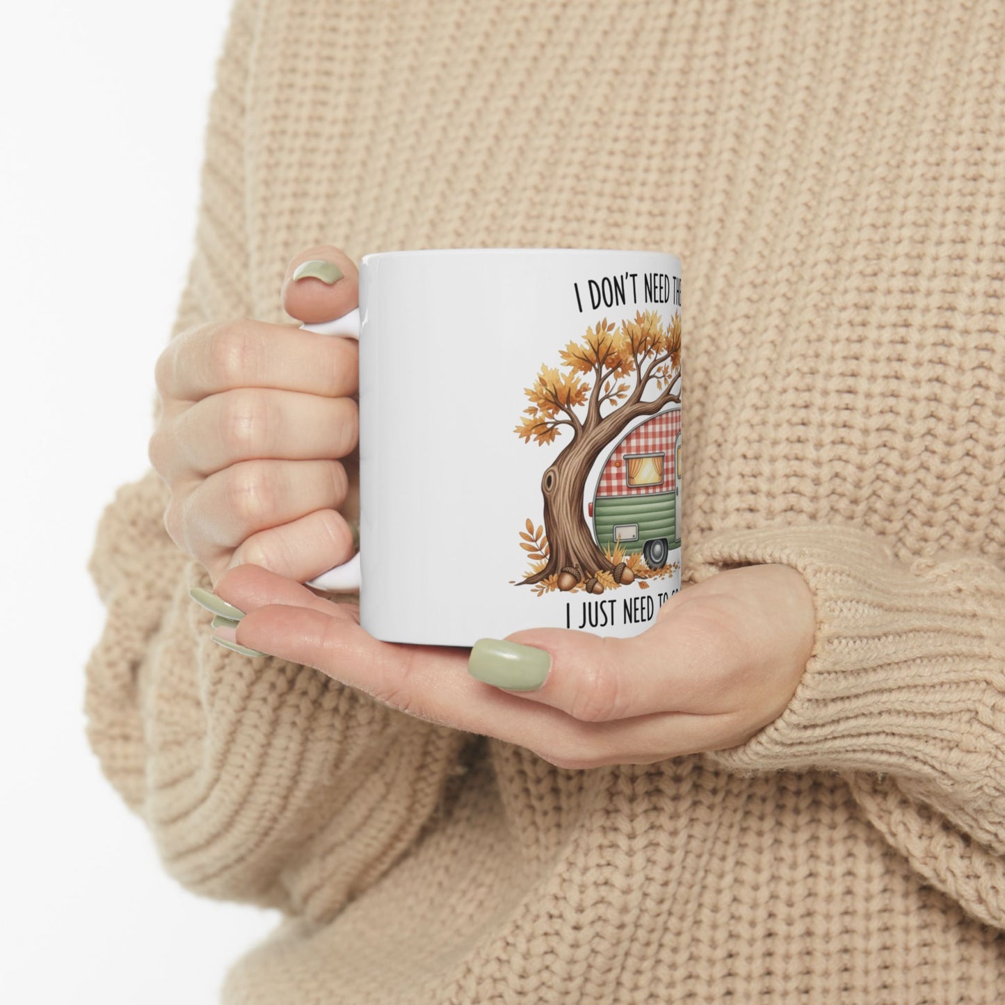 White mug with "I DON'T NEED THE..." and camper tree graphic.