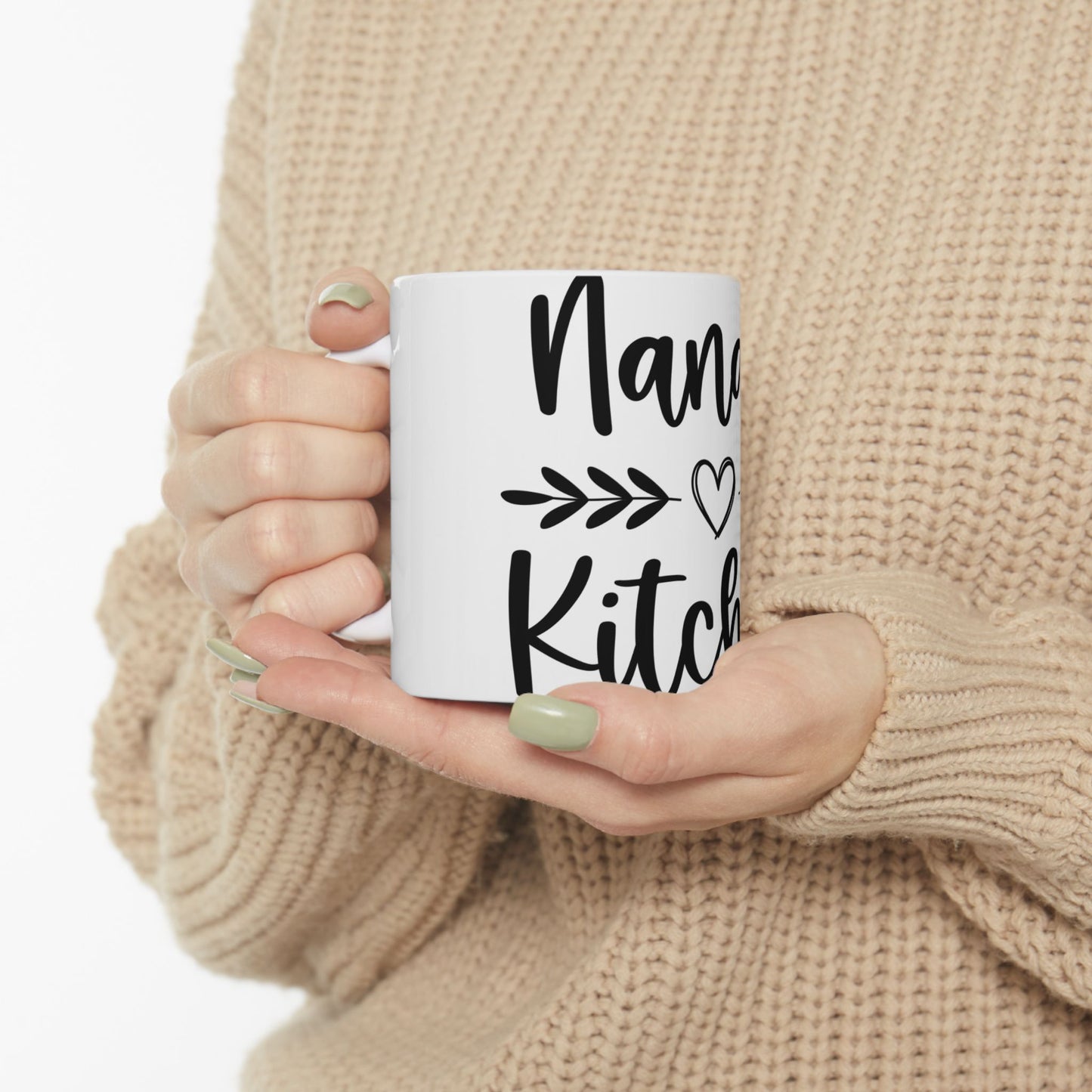 White mug with black text that reads "Nana's Kitchen" and a heart.