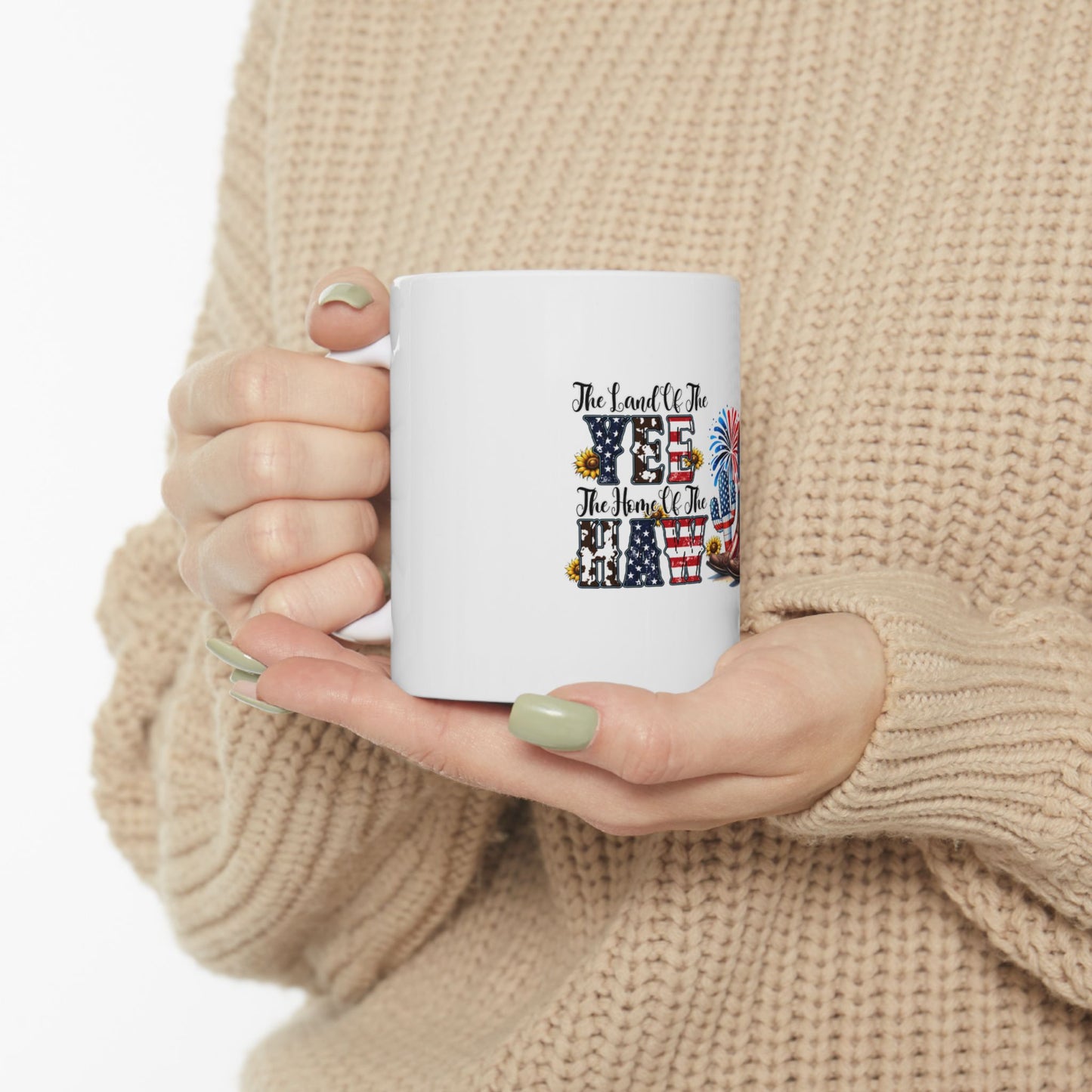 White mug with "Land of the Free, Home of the Brave" text and patriotic icons.
