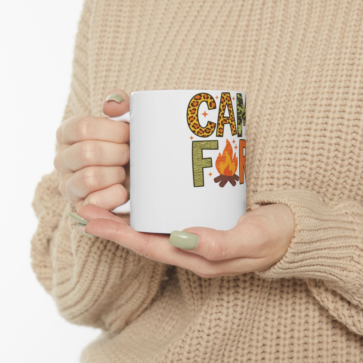 White mug with "Camp F" text in animal print and orange lettering.
