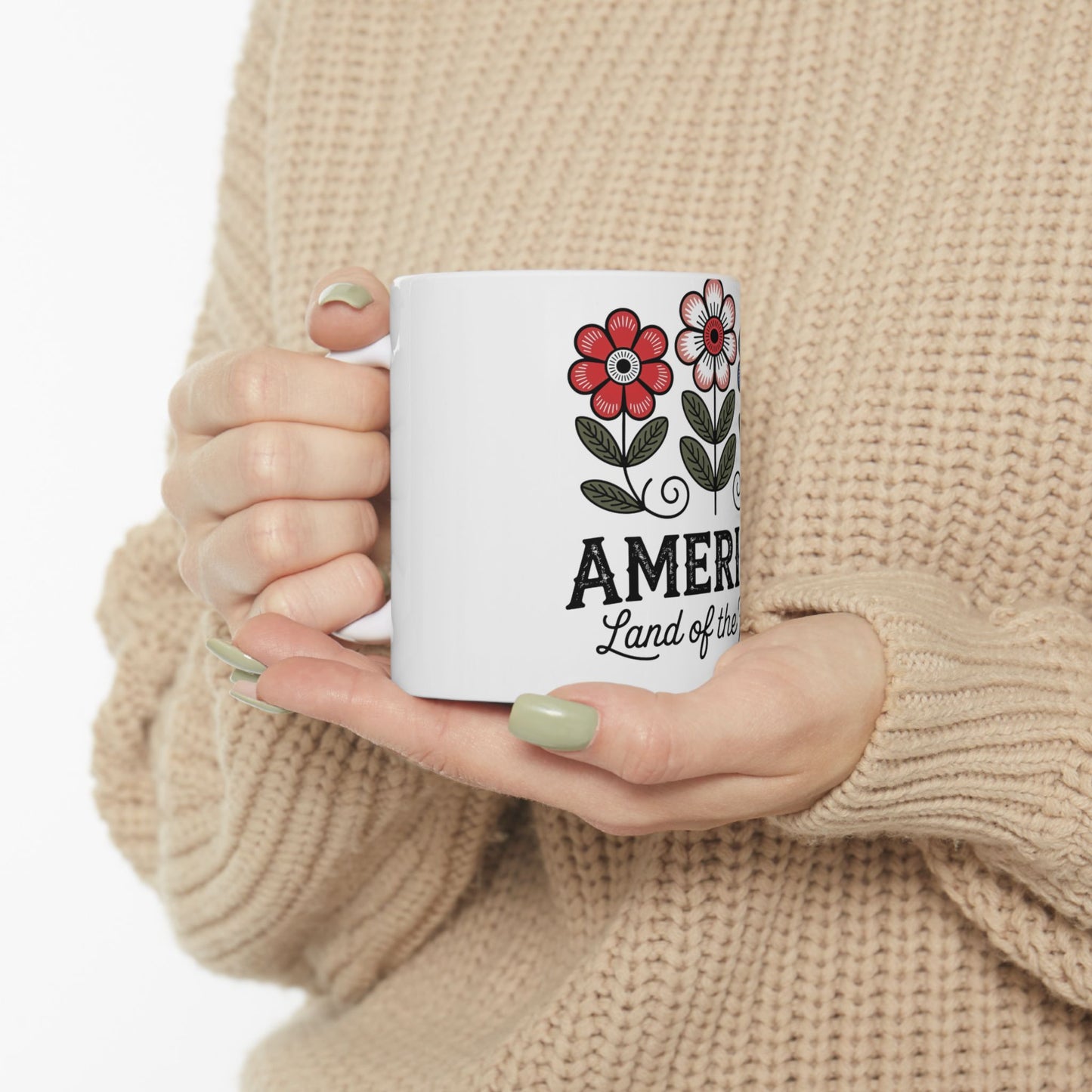 White mug with red flowers and "America Land of the Free" text.
