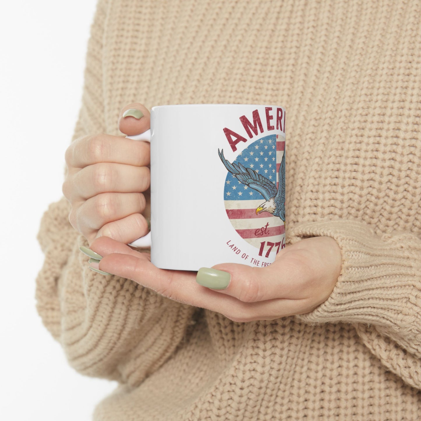 White mug with "America Est. 1776 Land of the Free" and eagle.