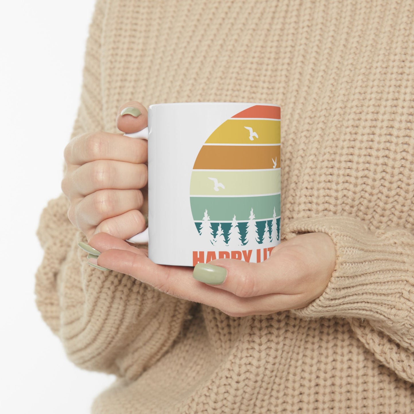 White mug with retro sunset over pine trees and birds, text "HAPPY LIT".
