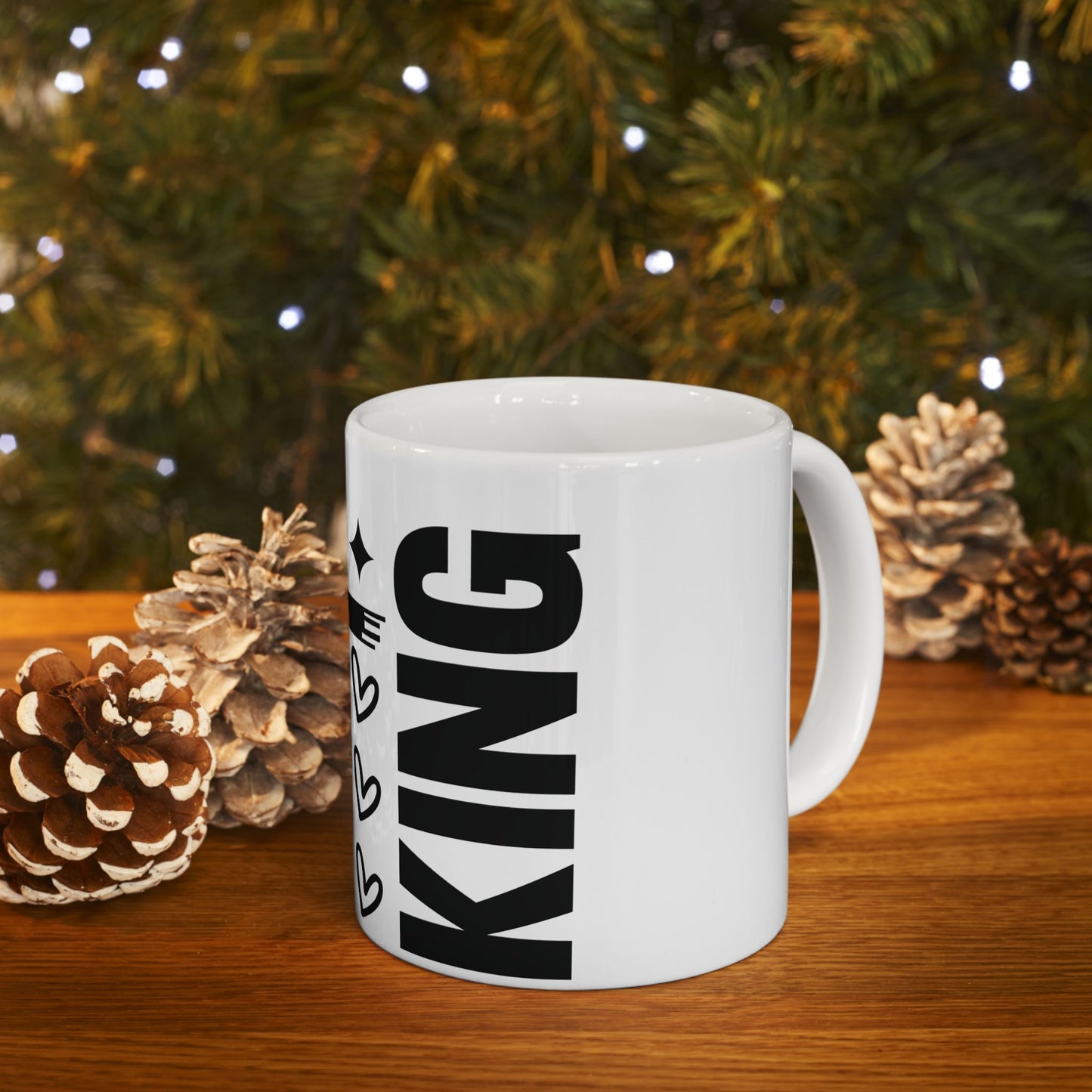White mug with "KING" in large black text and small heart accents.
