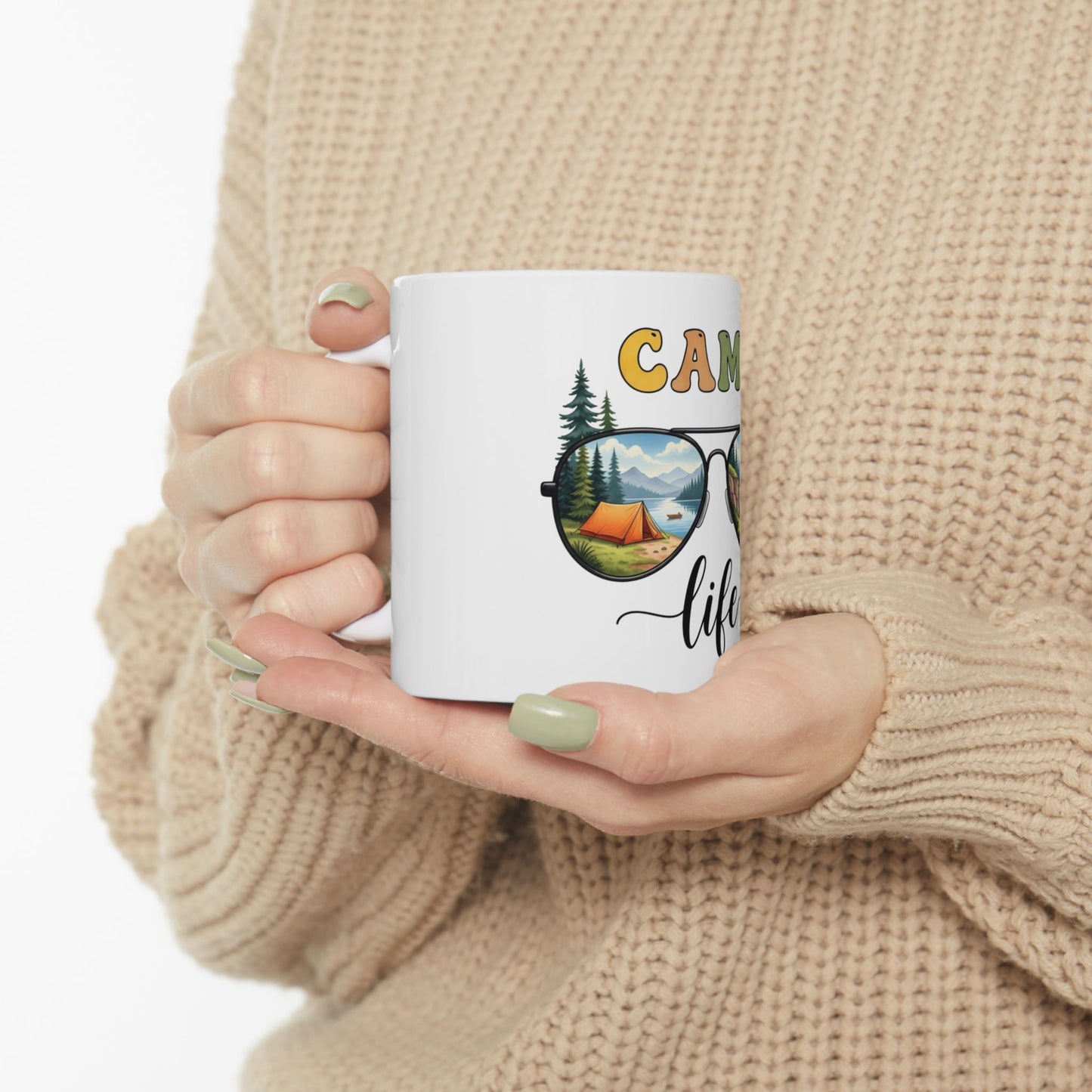 White mug with "Camping Life" text and landscape scene in sunglasses design.