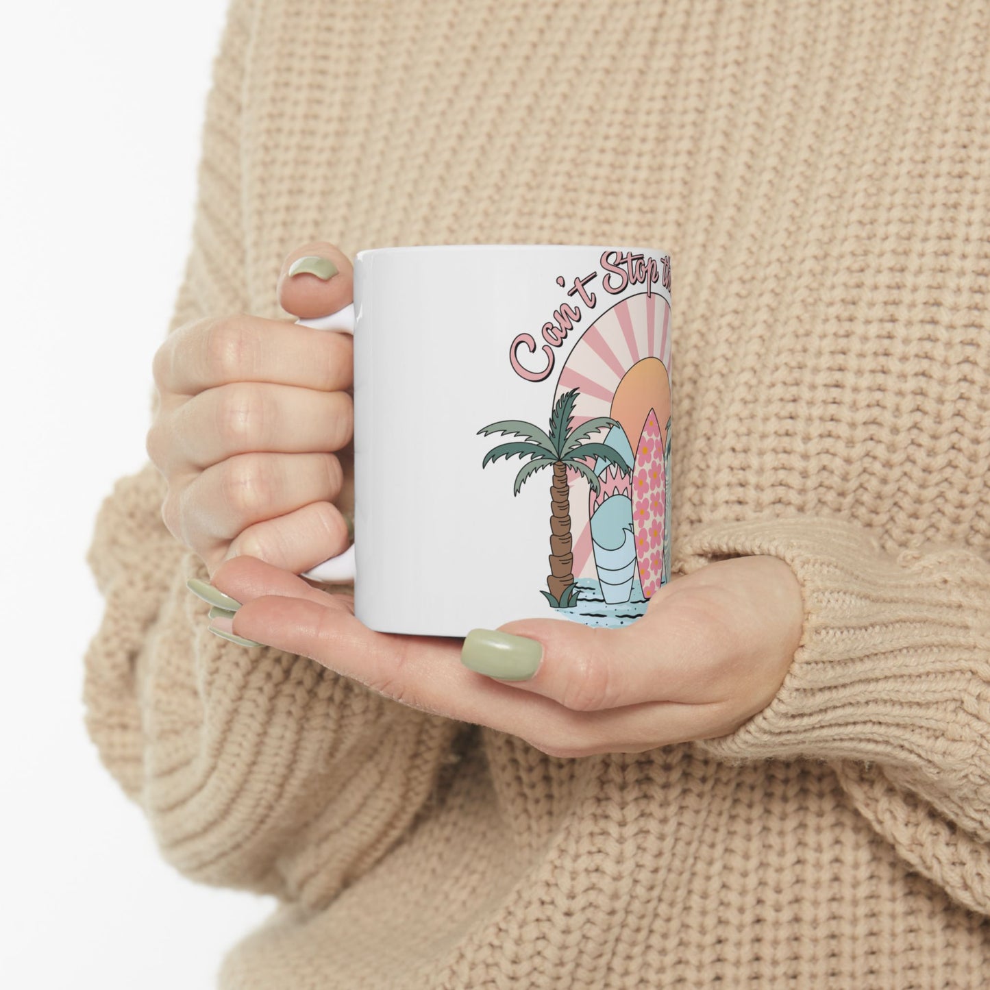 White mug with beach-themed design featuring a palm tree, surfboard, and sun.