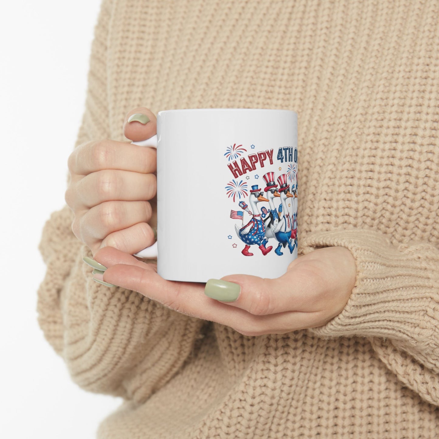 White mug with cartoon geese celebrating 4th of July.