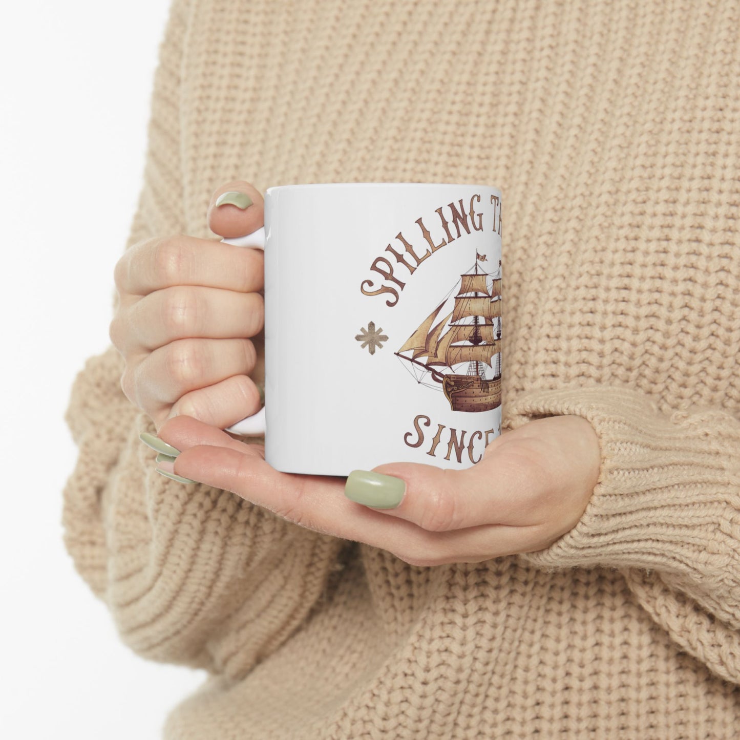White mug with a sailing ship and "Spilling the tea since..." text.