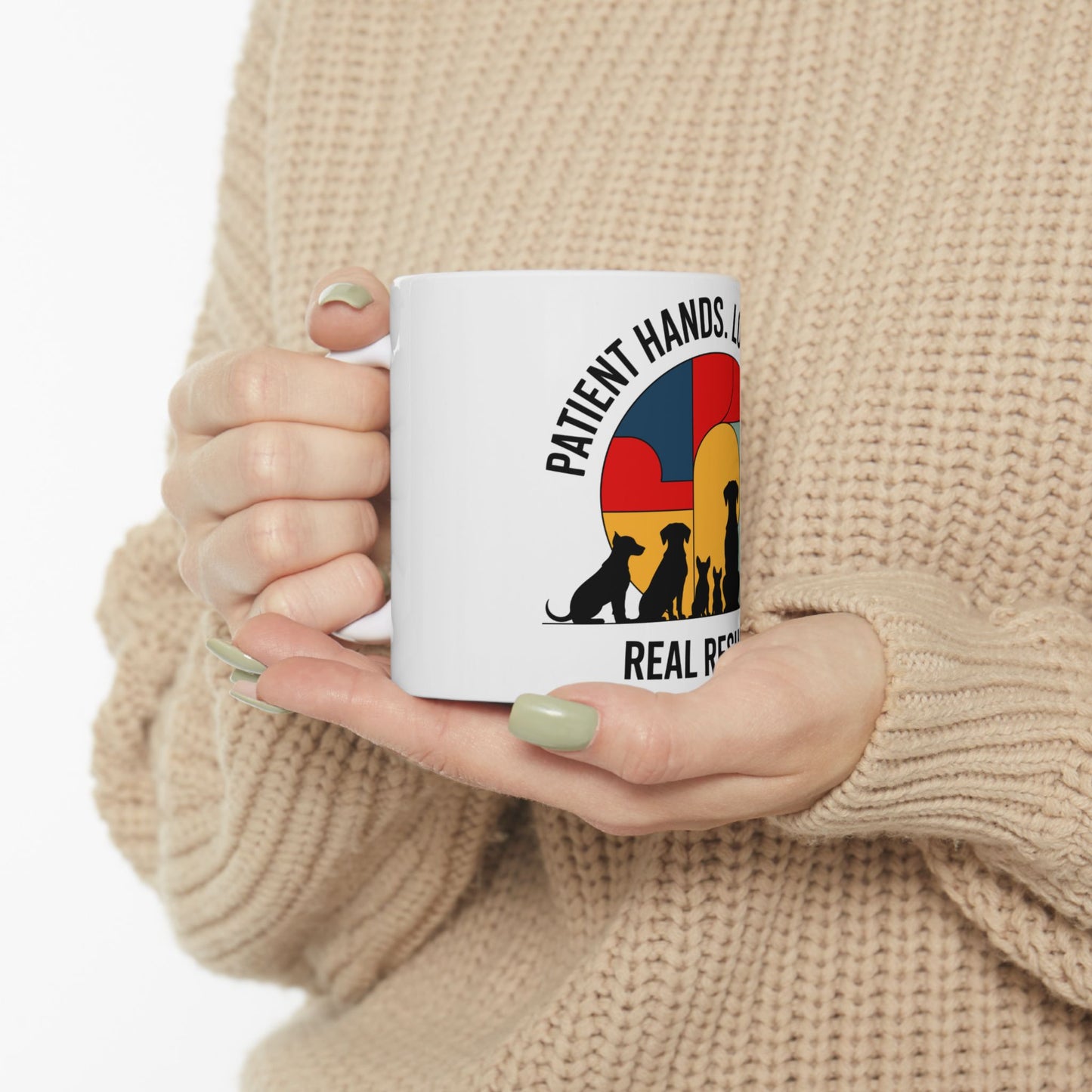 White mug with colorful animal silhouette logo and text.