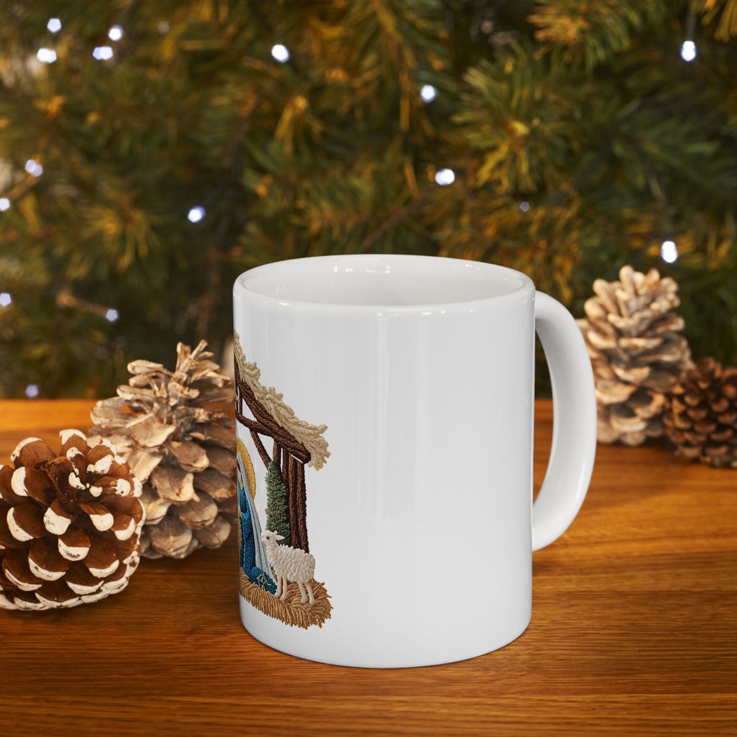 White mug featuring a Nativity scene with Mary, Jesus, and a lamb.