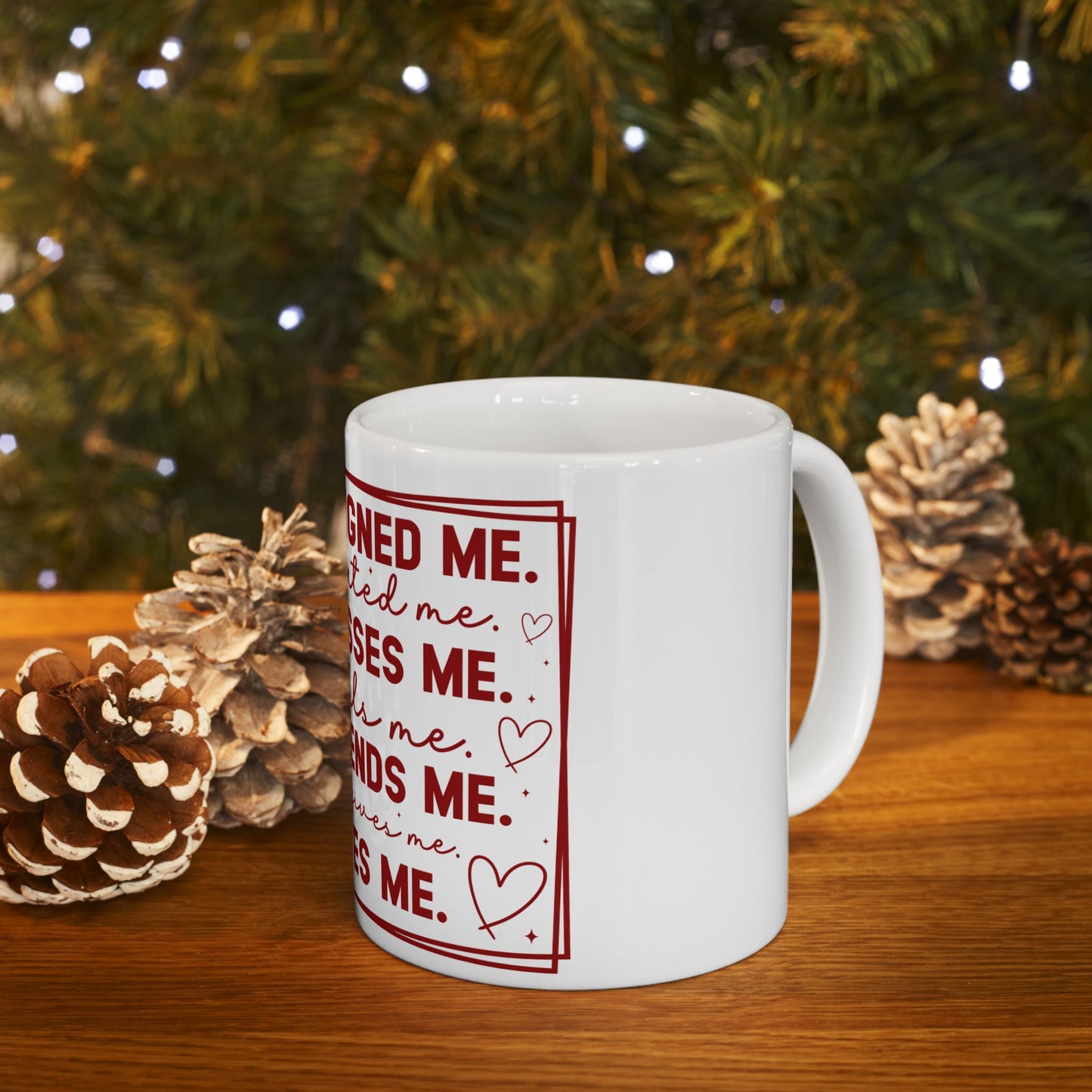 White mug with red text "Signed me. Loved me. Sees me. Needs me. Owed me. Hates me. Cares me. Wins me."