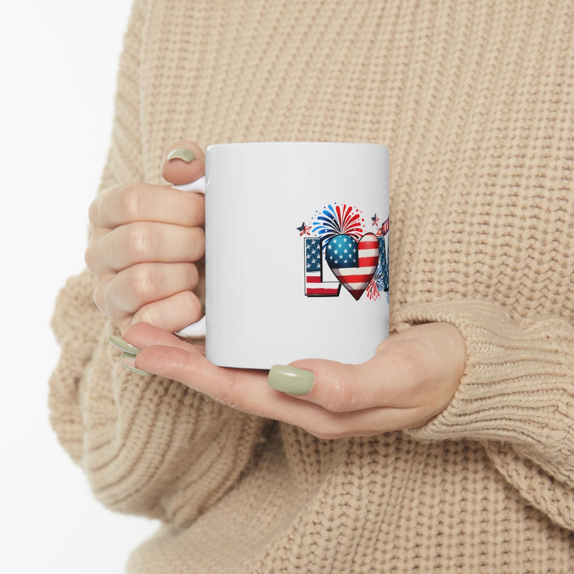 White mug with "LOVE" in patriotic colors and fireworks.