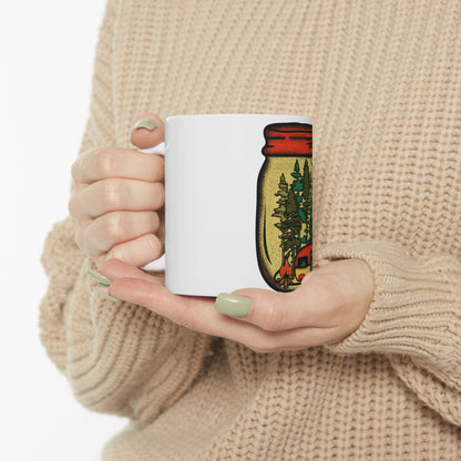 White mug with a camping scene inside a mason jar design.