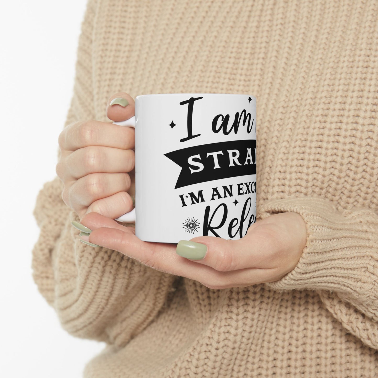 White mug with "I am a strategist" and "I'm an excellent relaxed" text.