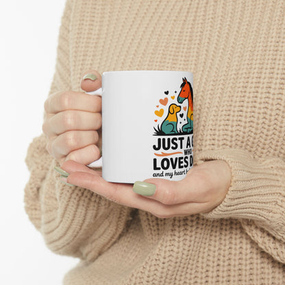 Mug with "JUST A WHO LOVES D" and heart illustration.
