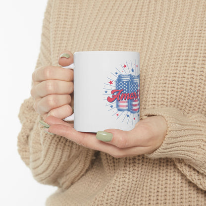 White mug with "America" text and red, white, and blue cans.