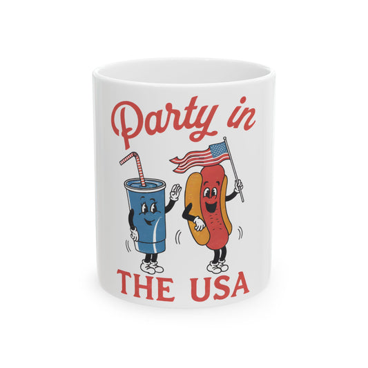 Mug with hot dog and soda characters waving American flag, "Party in the USA" text.