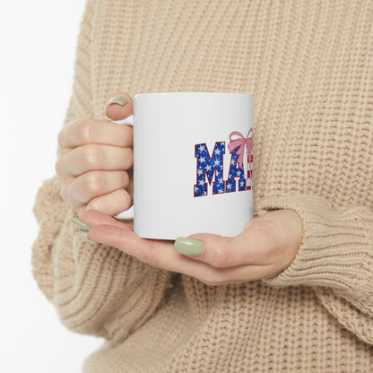 White mug with "MAY" in patriotic lettering and a pink bow.