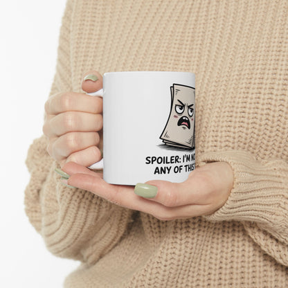 White mug with cartoon paper character that says "SPOILER: I'M NOT ANY OF THIS".
