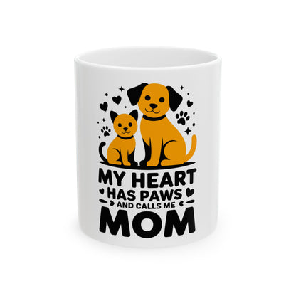 Mug with dog and cat graphic and text "MY HEART HAS PAWS AND CALLS ME MOM".