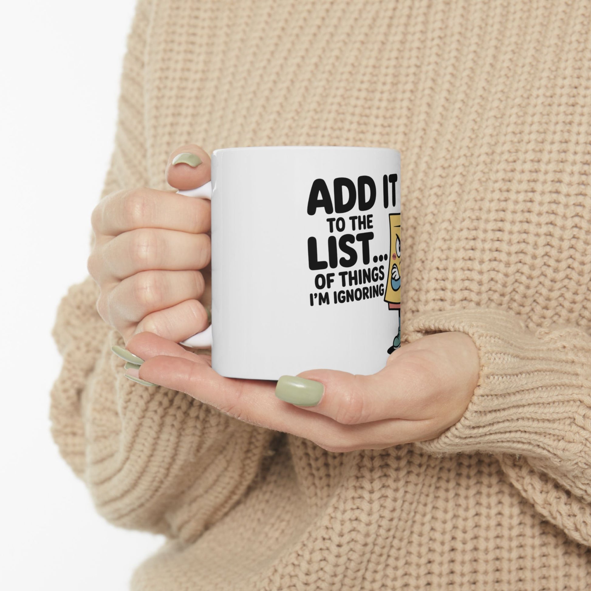 White mug with "ADD IT TO THE LIST... OF THINGS I'M IGNORING" text.