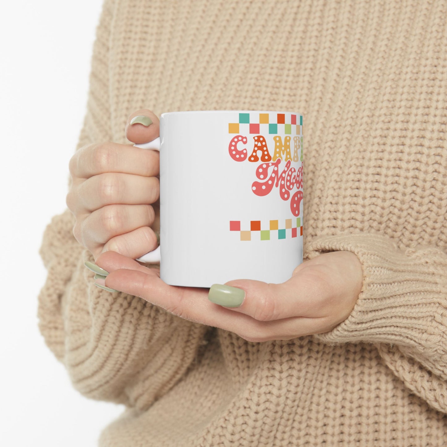 White mug with colorful "CAMP MOM" text and pixelated squares.