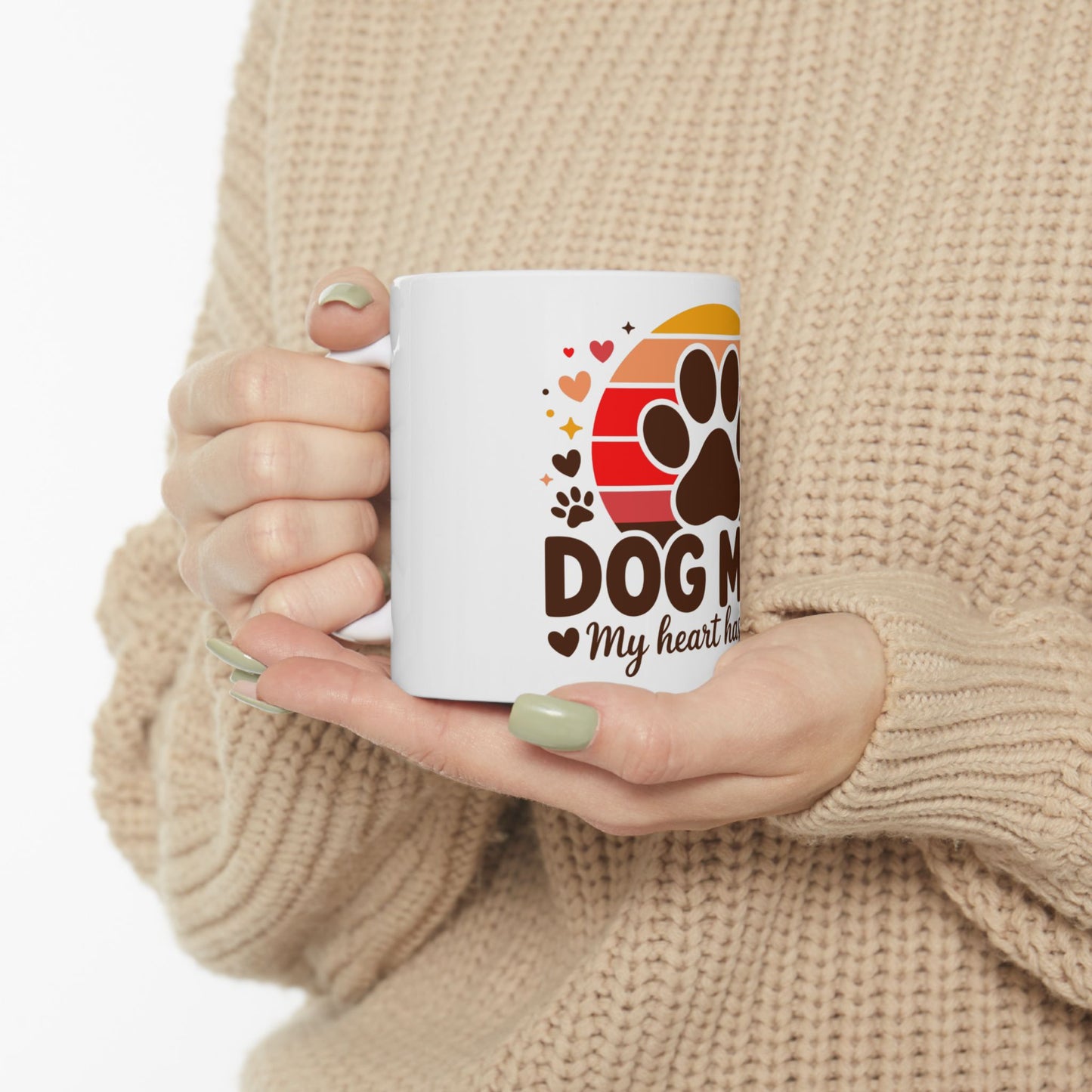 White mug with "Dog Mom My heart ha" and paw print graphic.