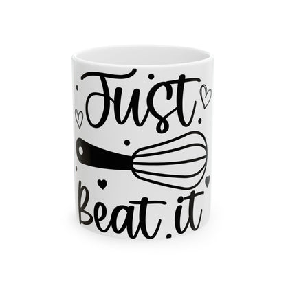 White mug with "Just beat it" text and whisk illustration.