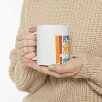 White mug with "Life is better around the campfire" text and flame graphic.
