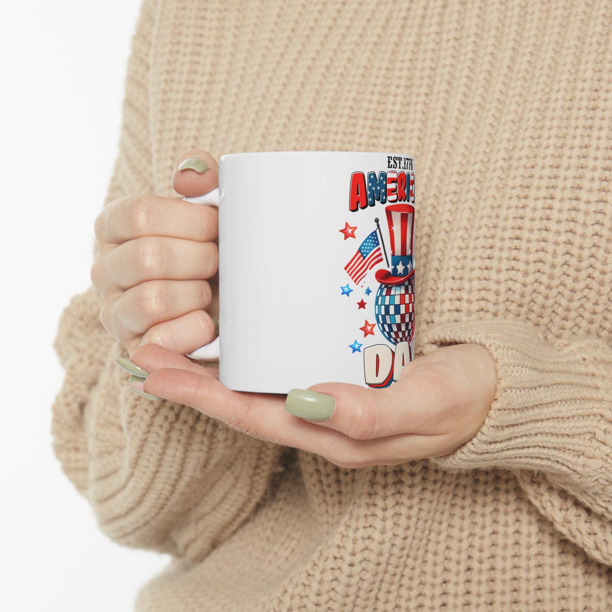 White mug with Fourth of July graphics: Uncle Sam hat, disco ball, and flag.