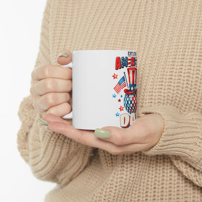 White mug with Fourth of July graphics: Uncle Sam hat, disco ball, and flag.