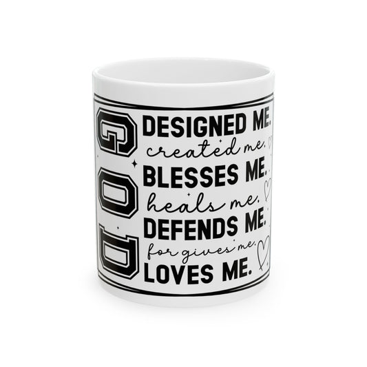Mug with "GOD DESIGNED ME, BLESSES ME, DEFENDS ME, LOVES ME" text.