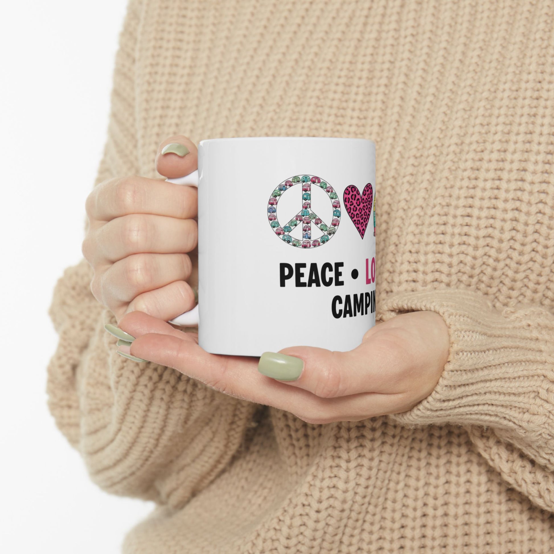 White mug with "Peace, Love, Camping" text and colorful peace sign and heart icons.