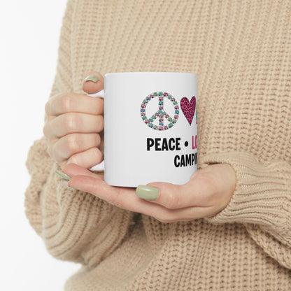 White mug with "Peace, Love, Camping" text and colorful peace sign and heart icons.