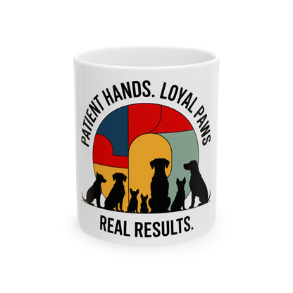 Mug with silhouettes of dogs and text "PATIENT HANDS. LOYAL PAWS. REAL RESULTS."
