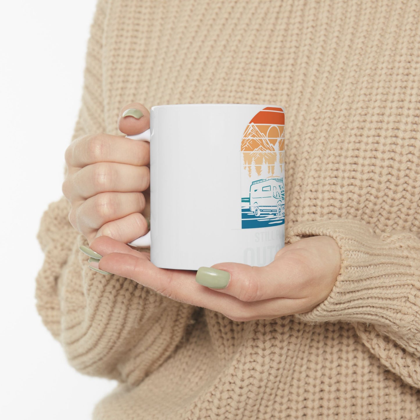 White mug with camper van and mountain graphic.