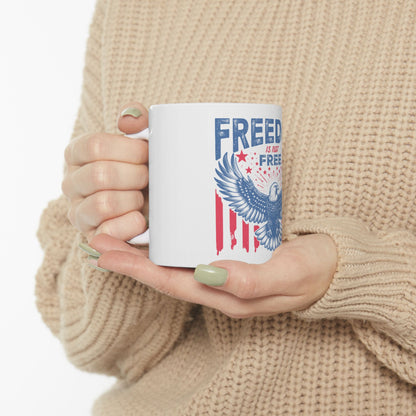 White mug with American flag design and eagle graphic.