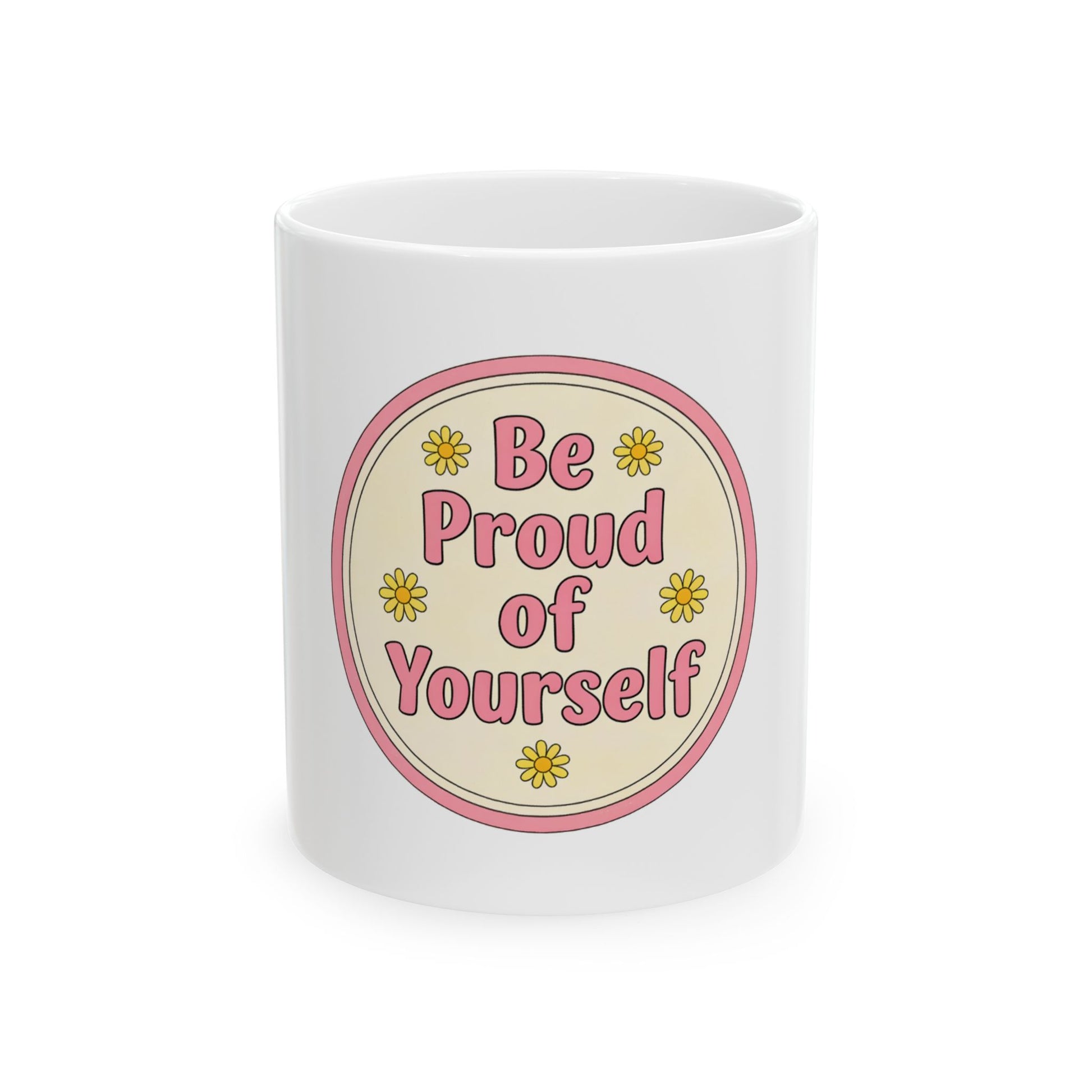 White mug with pink circle and yellow flowers, text "Be Proud of Yourself".