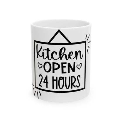 White ceramic mug with black text "Kitchen OPEN 24 HOURS" and heart accents.