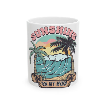 Mug with "Sunshine on My Mind" text and a beach wave with palm trees.