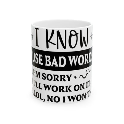 White mug with humorous text about using bad words.