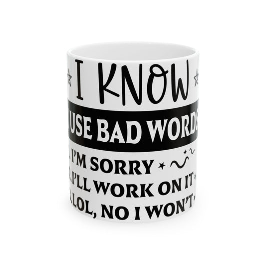 White mug with humorous text about using bad words.