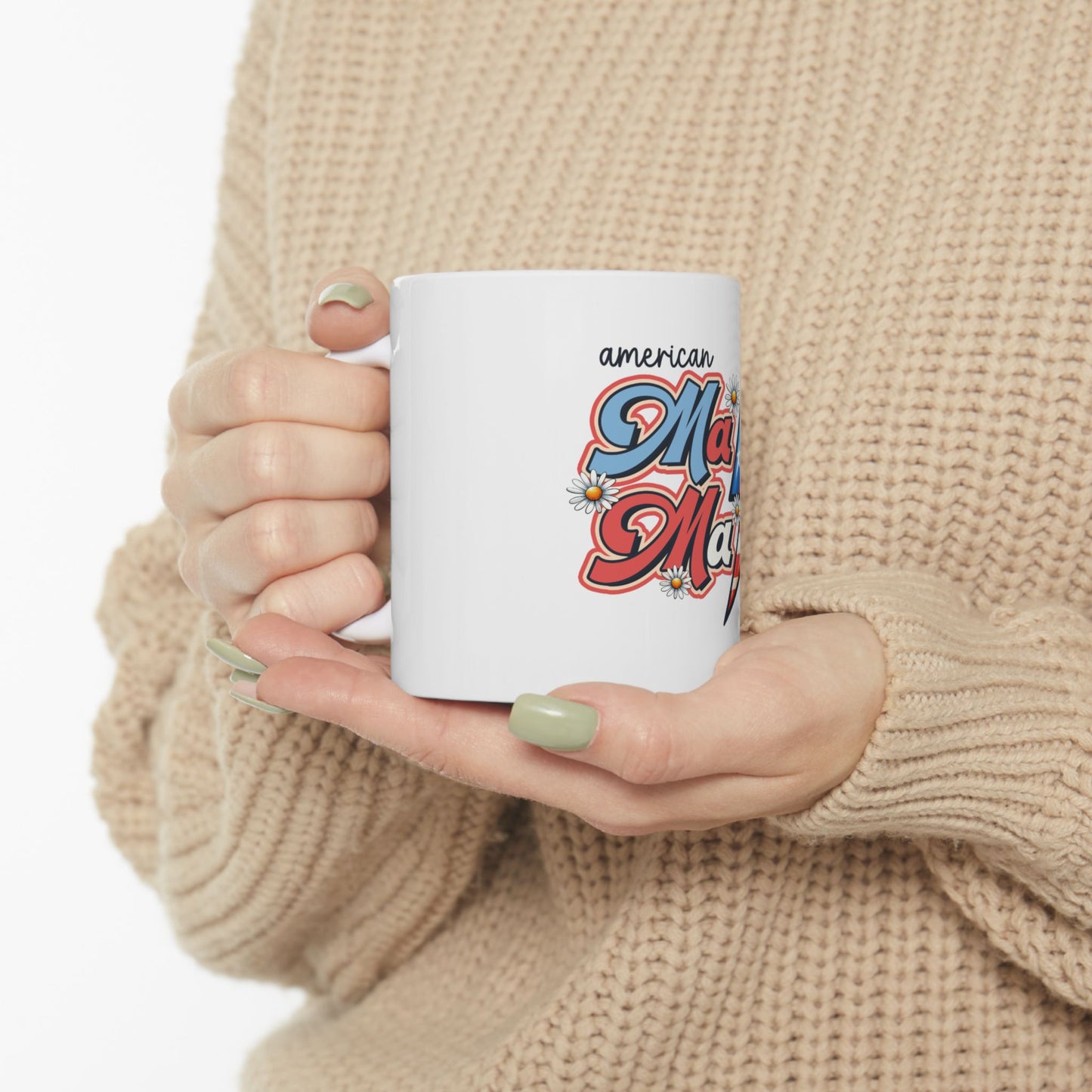 White mug with "American Mama" text and floral graphics.